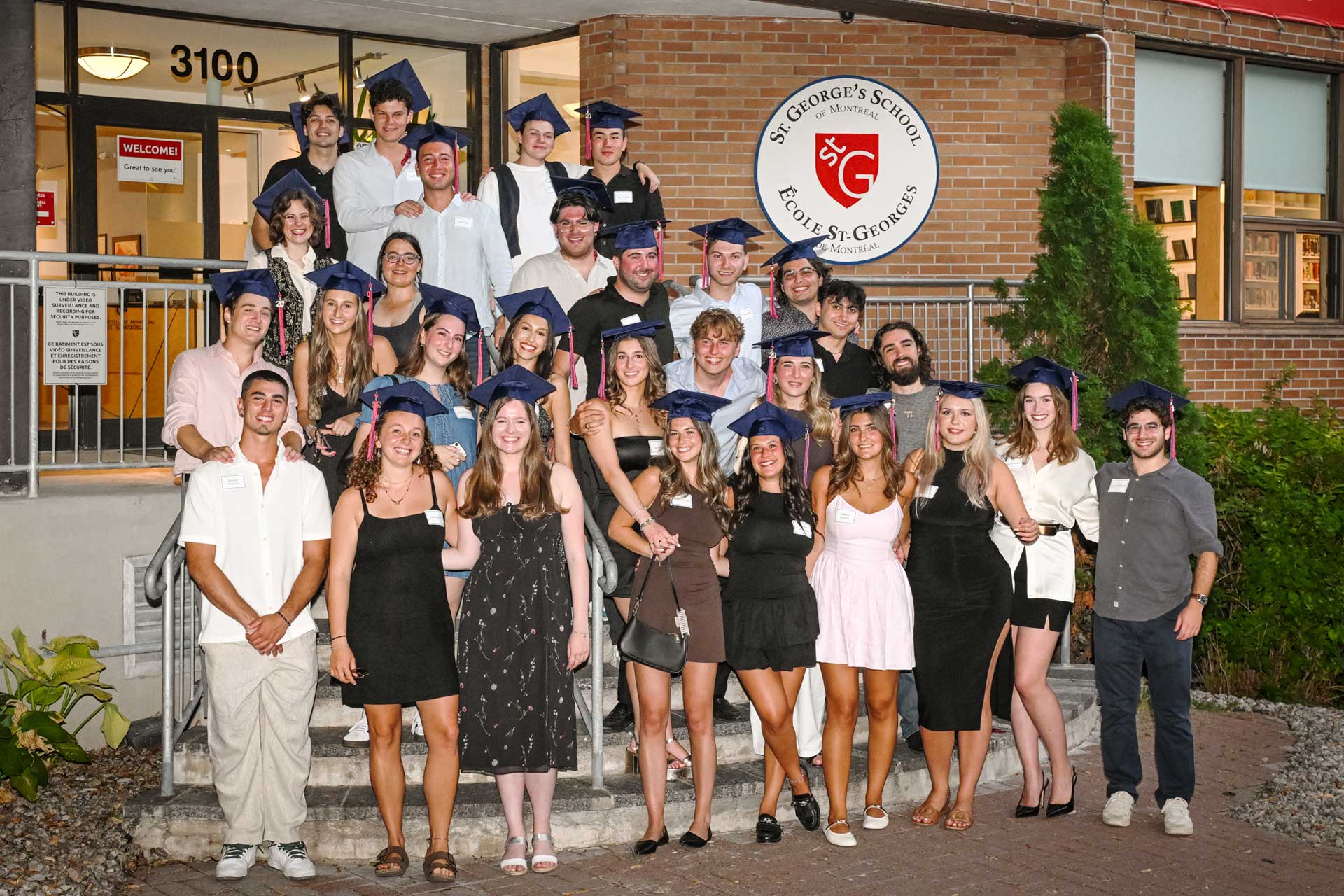 Photo of 2020 Alumni Reunion in front of building facade