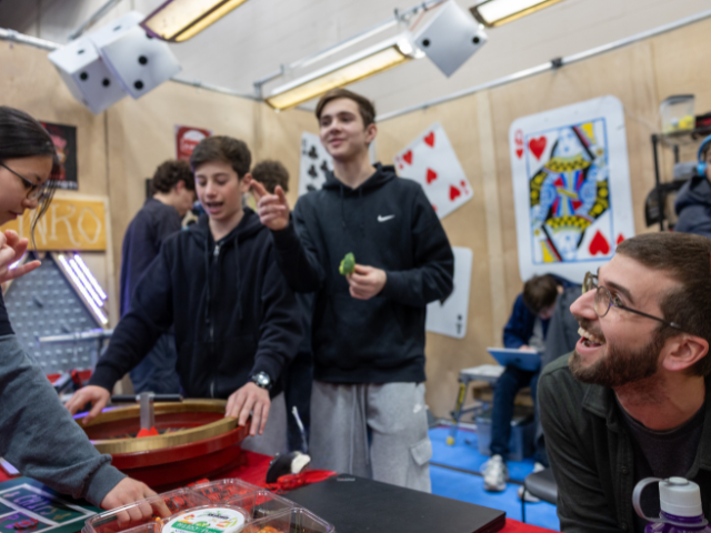 A student plays games at the kiosk.