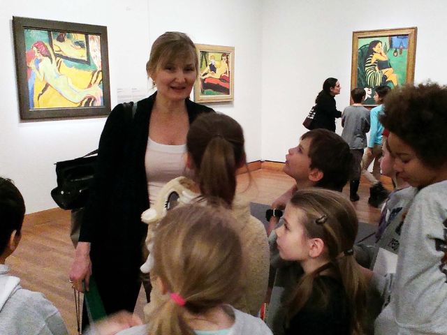 Zenia guides students through the galleries.